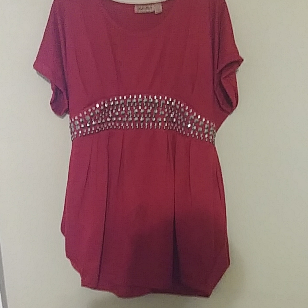 A Beautiful Red Top with Gold Around The Waist.